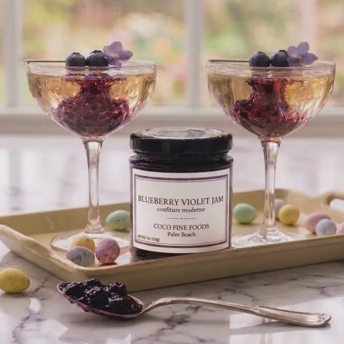 Blueberry Violet Jam Cocktail. Blueberry Violet Jam swirled into a glass of prosecco
